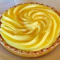 Tarte Citron · A smooth and rich lemon custard in a shortbread tart shell with a layer of almond cream