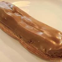 Cafe' Eclair · Pâte à choux filled with a smooth coffee custard, iced with coffee flavored Fondant.