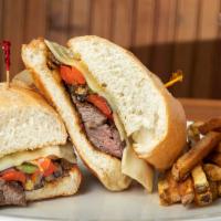 Philly Steak · Grilled sliced steak with green & red pepper, onion, swiss cheese & mayo on a toasted hoagie...