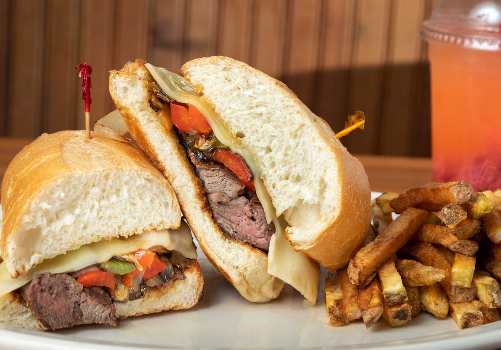 Philly Steak · Grilled sliced steak with green & red pepper, onion, swiss cheese & mayo on a toasted hoagie roll