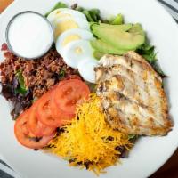 Cobb · Mixed greens topped with grilled chicken, diced bacon, hard boiled egg, tomato, cheddar chee...