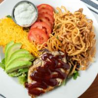 Bbq Chicken Salad · Grilled chicken topped with BBQ sauce on a bed of mixed greens, cheddar cheese, tomatoes, av...