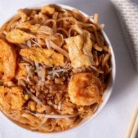 Pad Thai · One of Thailand's best known noodle dishes. Rice noodles stir-fried with chicken, shrimp, eg...