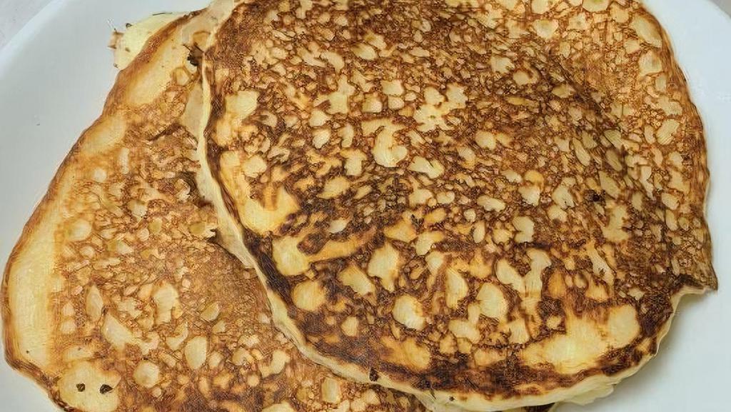 Gf Pancakes · gluten-free pancakes served with butter and syrup