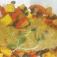 Tofu Scramble · scrambled tofu with golden potatoes, turmeric, black beans,
red peppers and tomatillo d’arbo...