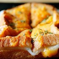 Garlic Cheese Toast · garlic powder, cheddar cheese, parsley flake, milk toast, rice cake, maple syrup.