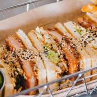 Chicken Katsu · Panko chicken cutlet, cabbage, tonkatsu sauce, and house special aioli.  Served on toasted w...