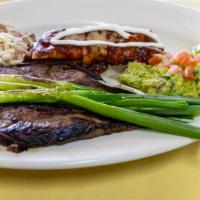 New York Steak Tampiqueña Style · Dish comes with 1 cheese enchilada, guacamole and beans. This dish come with tortillas. Plea...