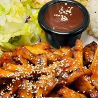 Spicy Pork Teriyaki · Spicy Pork top with sesame seeds. Combo comes with a side of Steam Rice, side of macaroni sa...