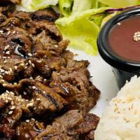 Beef Teriyaki · Grilled Beef top with Sesame seeds. Comes with macaroni salad. Side of Steam Rice. Side of G...