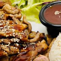 Pork Teriyaki · Grilled Pork top with Teriyaki Sauce with Sesame seeds. Comes with macaroni salad. Side of S...
