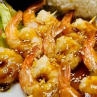 Shrimp Skewer Teriyaki · Shrimps top with Teriyaki Sauce and Sesame seeds. Comes with macaroni salad. Side of Steam R...