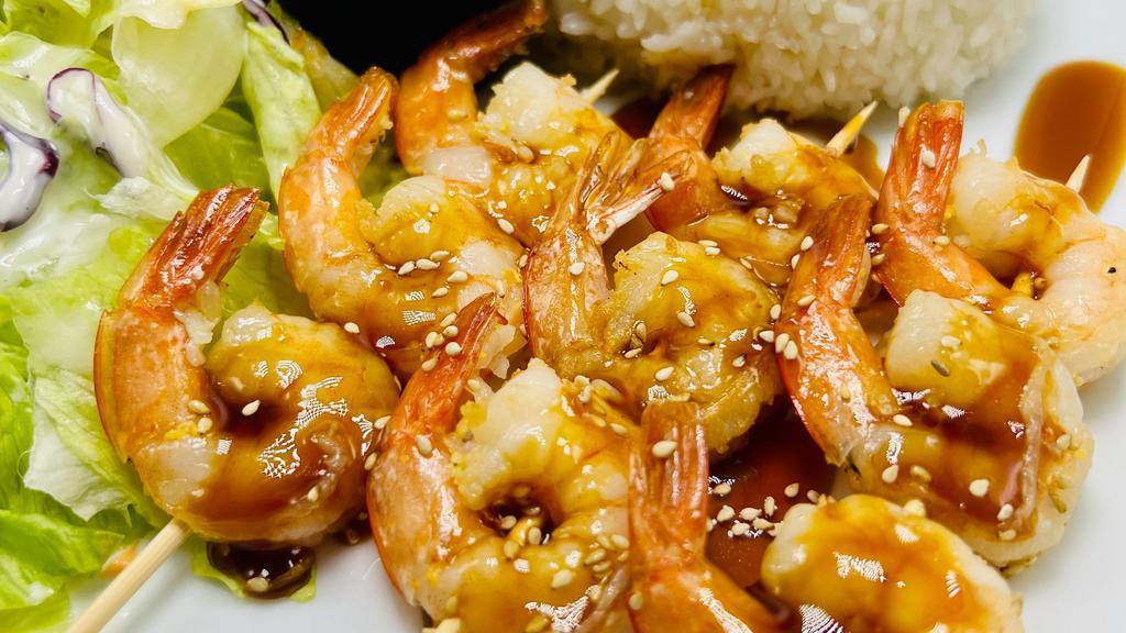Shrimp Skewer Teriyaki · Shrimps top with Teriyaki Sauce and Sesame seeds. Comes with macaroni salad. Side of Steam Rice. Side of Garden Salad & house dressing.