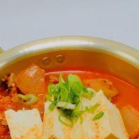 Kimchi Nabe · Dish contains Kimchi, Pork Belly and Tofu. Top with green onions. Comes with a side to rice.