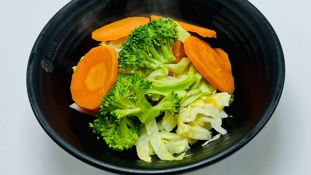 Steamed Vegetables  · Carrots, Cabbage, and Broccoli steamed.