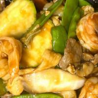 Triple Delight · Shrimp, beef and chicken stir-fried with vegetables in brown sauce.