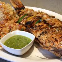 Attieke · Whole red snapper either grilled or fried with Ivory Coast fermented cassava couscous, onion...