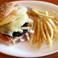 Senegambian Burger · Char-grilled beef patty with homemade seasonings piled with fries, egg, tomatoes, lettuce, o...