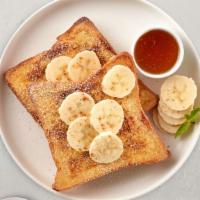 Banana Peanut Butter French Toast · Fresh bread battered in egg, milk, and cinnamon cooked until spongy and golden brown. Topped...
