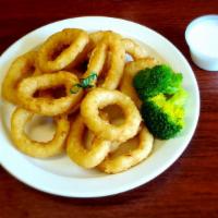 Onion Rings · The rings are made from slices of onion, coated with batter and deep-fried until golden-brown.