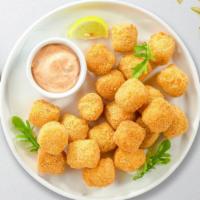 Just Tots · (Vegetarian) Shredded Idaho potatoes formed into tots, battered, and fried until golden brow...
