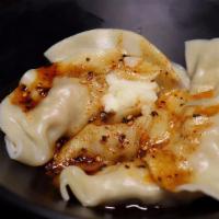 Handmade Sichuanese Style Dumpling 钟水饺 · A traditional Chengdu small dish, These pork dumplings are drizzled with a sweet and spicy s...