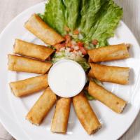 Taquitos Bites · 10 slices of deep fried taquitos served with pico de gallo and sour cream sauce for dipping....