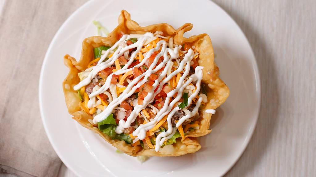 Taco Salad · Flour tortilla shell filled with your choice of meat, shredded Chicken or shredded beef, beans, lettuce, pico de gallo cheese, and sour cream.
CHIPAS AND SALSA