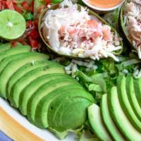 Stuffed Avocado · A full avocado pitted and filled with our blend of shrimp and crab. Topped with cheese. Serv...