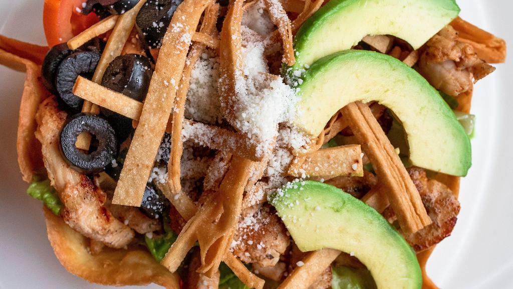 Olivia Salad · Slices of tender Grilled Chicken Breast or Steak on a bed of fresh greens. Topped with onions, avocado slices, tomatoes, black olives, crispy tortila strips, cotija and cheese cheese. Served with our homemade avacado ranch.