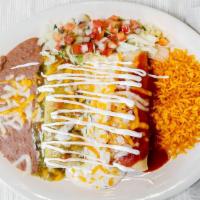 Enchilada Tricolor · Three enchiladas and one shredded beef topped with enchilada sauce. One chicken topped with ...