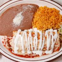 Burrito Bueno · Filled with your choice of meat (ground beef or chicken ) beans, topped with ranchera sauce,...