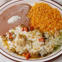 Burrito Chile Verde · Filled with slow roasted green chile pork, rice, beans, topped with tomatoes, melted cheese,...