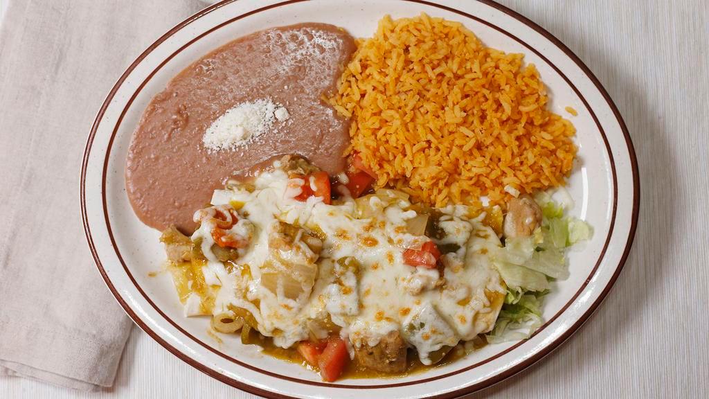 Burrito Chile Verde · Filled with slow roasted green chile pork, rice, beans, topped with tomatoes, melted cheese, and chile verde sauce. Served with rice and beans.
CHIPS AND SALSA