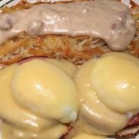 Eggs Benedict · Two poached eggs with Canadian bacon and toasted English muffin covered with hollandaise sau...