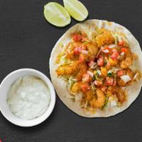 Shrimp Taco · Marinated shrimp cooked bell pepper, onion, sour cream, rice & cheese in a soft shell tortilla