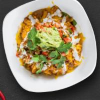 Chicken Burrito Bowl · Grilled chicken and special spices, and topped with cheese, sour cream, guacamole, and rice....