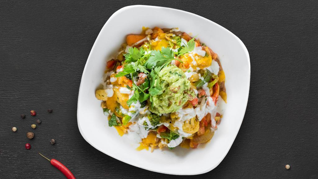 Veggie Burrito Bowl · Sauteed carrots, broccoli, cauliflower, mushrooms, bell peppers, onions, tomatoes, special spices, and topped with cheese, sour cream, and guacamole, and rice.. Choice of beans.