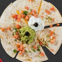 Quesadillas · A grilled flour tortilla with choice of protein topped with melted Jack and Cheddar cheese, ...