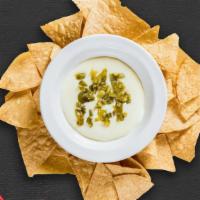 Chips & Queso · Plain chips with queso dip on the side