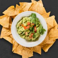Guacamole & Chips · A heaping scoop of fresh guacamole and warm tortilla chips