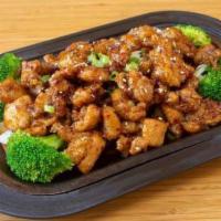 Broccoli Chicken / 西兰花鸡 · Chicken stir-fried with broccoli carrots and onions in brown sauce.