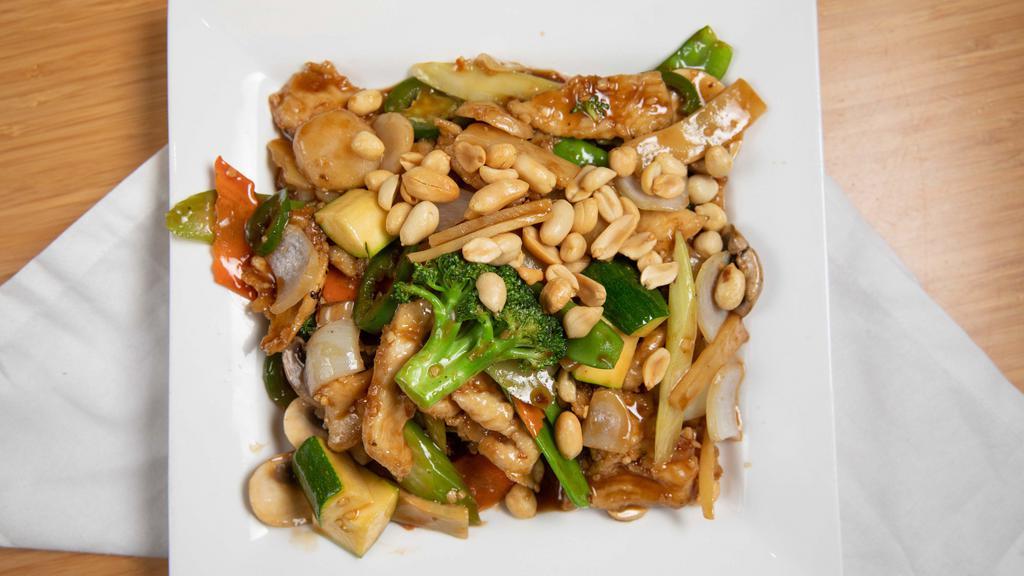 Kung Pao Chicken / 宫保鸡丁 · Chicken stir-fried with diced celeries, broccoli, snow peas, white mushroom, onion,  bamboos, carrots, water chestnuts, peanuts, and chili pepper in kung pao sauce.