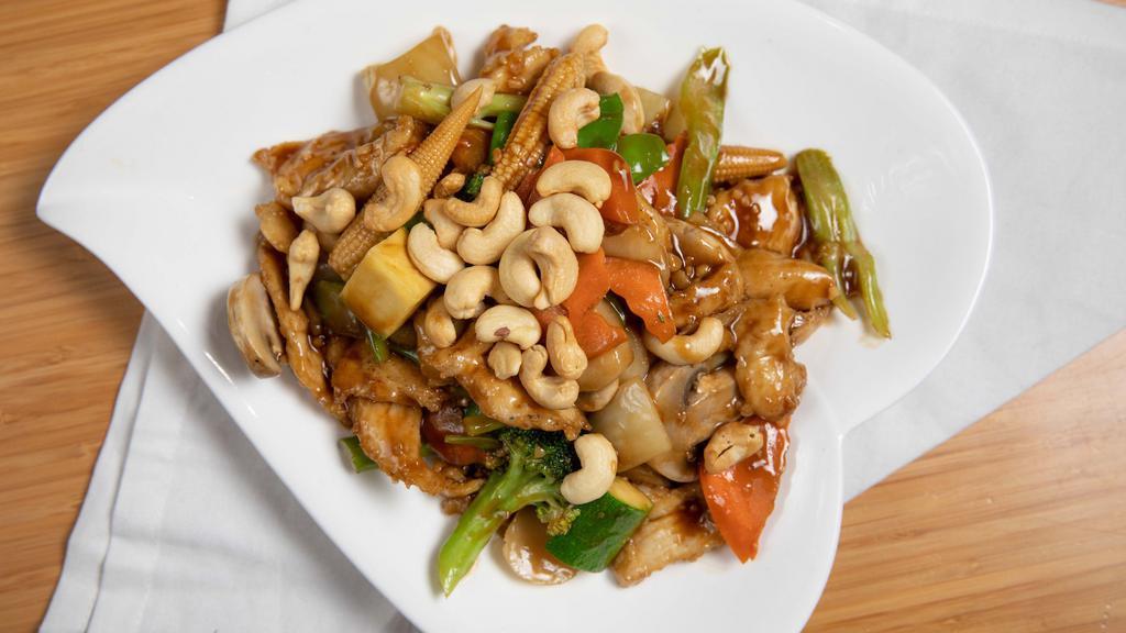 Cashew Chicken / 腰果鸡 · Chicken stir-fried with celeries broccoli snow peas white mushroom carrots water chestnuts and cashew nut served with white rice.
