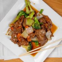 Broccoli Beef · Beef stir-fried with broccoli carrot and onion in brown sauce.