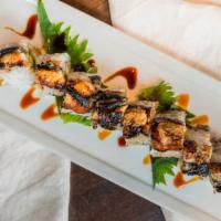 Dragon Roll · Barbecue eel, tempura shrimp, avocado, drizzled with eel sauce.