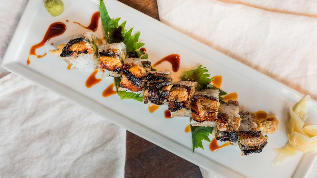 Dragon Roll · Barbecue eel, tempura shrimp, avocado, drizzled with eel sauce.