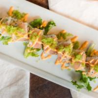 Seahawks Roll · California roll topped with seared white tuna, wasabi mayo, jalapeno masago.