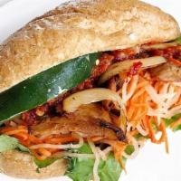 Banh Mi Baguette With Chick Less Saute · Baguette bread, lettuce, cucumber,vegenaise, pickled carrots, daikon and protein. Chick less...