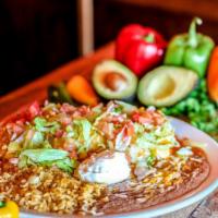 Big Bertha'S Burrito · A large flour tortilla stuffed with black beans, mixed shredded cheese, Mexican rice, lettuc...